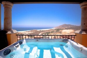 A hot tub with a view of the ocean and mountains. - Beautiful Oceanview Villa at Pueblo Bonito (Cabo San Lucas)