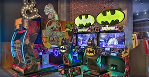 A row of arcade machines with 'Jurassic Park' and 'Batman' themes. - Montecristo Villa with Oceanviews (Cabo San Lucas)