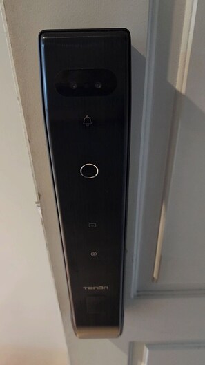 A black electronic device with a circular button, a small display, and the brand name 'TENON' on the bottom. - Skyline Studio - Panoramic View - Open 24 hours a day. Gym, Sauna, Laundry. Views. (Buenos Aires)