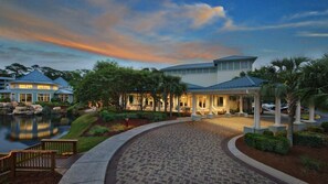 A resort with a pool, a covered patio, and a well-maintained garden. - Coastal SurfWatch Getaway with Ocean Vista & Spacious 2BR Comfort (Hilton Head Island)