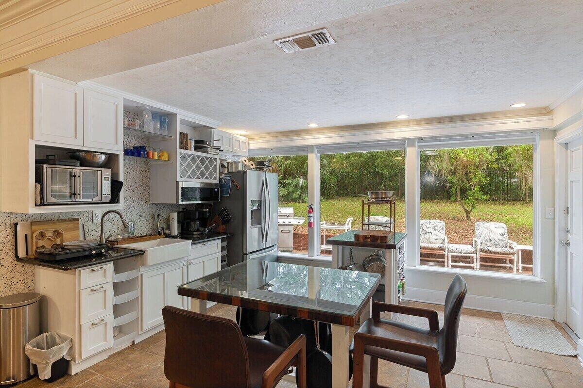 Fridge, stovetop, cookware/dishes/utensils, dining tables