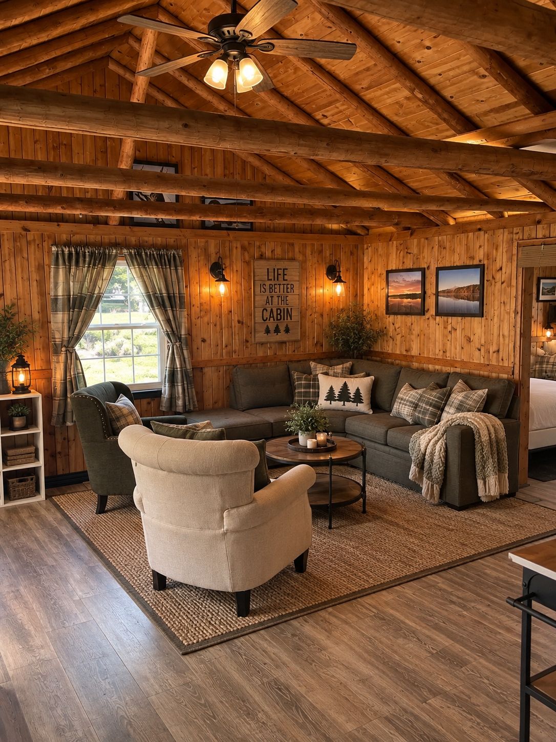 A cabin interior with a wooden ceiling, a sofa, a chair, a coffee table, and a window with curtains.