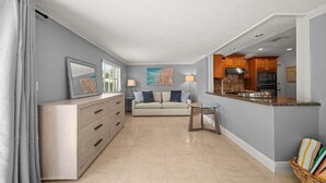 A modern apartment with a living area, kitchenette, and a dining space. - 2600 Managed by Brampton Park (Pompano Beach)