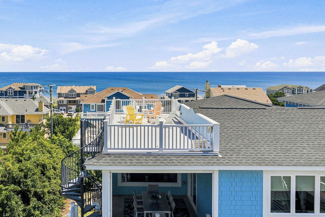 A coastal residential area with a view of the sea.