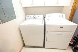 A laundry area with two white Maytag washers and dryers. - Oceanside-Priv Pool, Htub, Resort Access -133, I SEA the Light (Corolla)