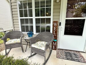 A porch with wicker chairs and a small table, a 'WELCOME' sign, and a house number '176'. - Relaxing Fletcher Townhome with proximity to Asheville and Hendersonville (Fletcher)