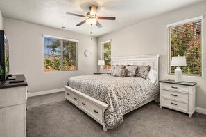 A bedroom with a bed, nightstands, a ceiling fan, and windows with blinds. - PV 8: Private Spa, BBQ, Air Hockey & Resort Amenities (Santa Clara)