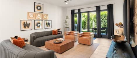 Bright, modern living room with comfortable seating.