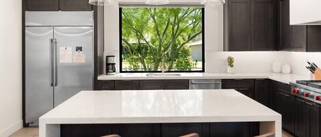 Oversized island perfect for meals and gathering.