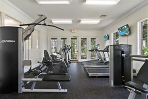 A gym with cardio machines, weight machines, and a treadmill. - Gameroom 2kingbeds Neardisney (Davenport)