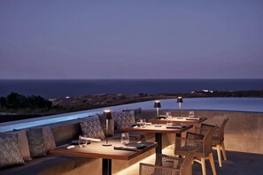 Outdoor dining - Magma Resort Santorini in of the Unbound Collection by Hyatt (Santorini)