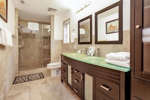 A modern bathroom with a glass sink, a walk-in shower, and a toilet. - Circle Views #1602 (Big Bear Lake)