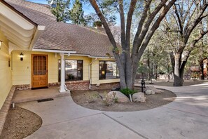 A residential building with a brick facade, a sloped roof, and a covered porch. - Bearfoot Lodge #2030 (Big Bear Lake)