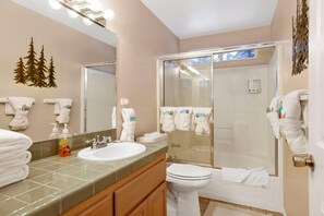 A bathroom with a sink, toilet, and shower. - Castle Glen Gem #2220 (Big Bear Lake)