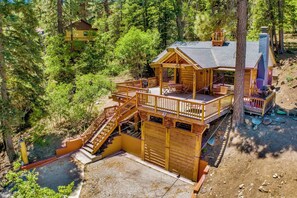 A wooden cabin with a balcony, a staircase, and a small deck area. - Club View Pines #2105 (Big Bear Lake)