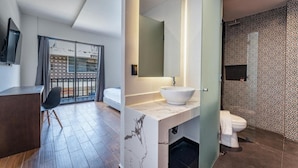 A modern bathroom with a large mirror, white sink, and a toilet. - Hotel Mexico (Mérida)