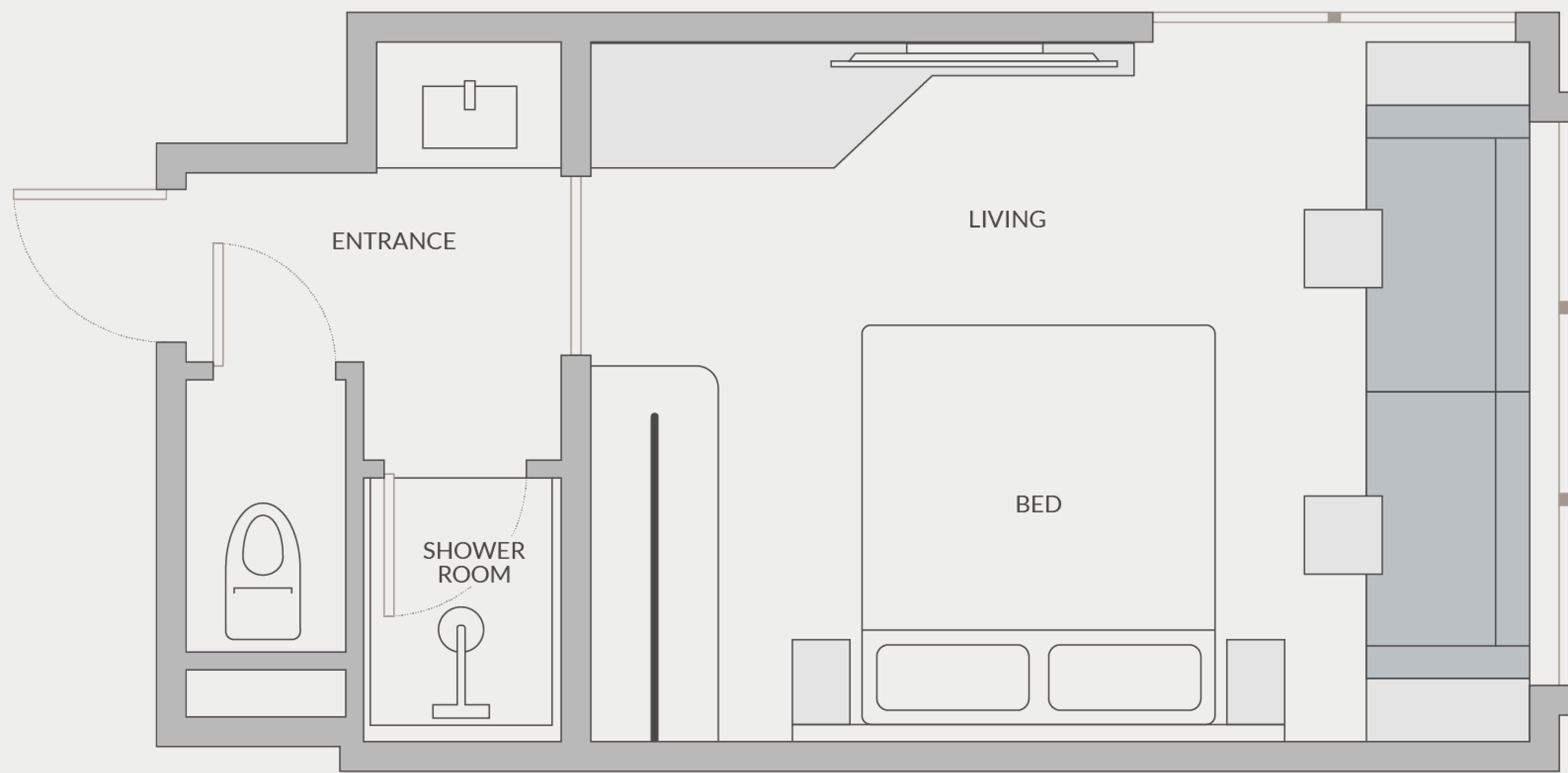 A floor plan with an entrance, living area, shower room, and bed.