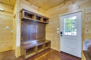 A wooden interior with a door, a bench, and a built-in cabinet. - 7 Mi to Lucas Oil Speedway! Home w/ Patio & Yard (Wheatland)