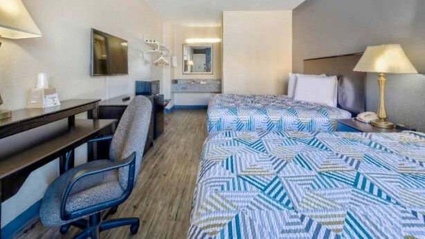 A hotel room with a bed, desk, chair, and a mirror. - 2 Queen Beds | Non-Smoking, Micfridge (Effingham)