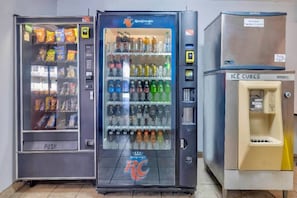 Three vending machines with various items, including snacks and beverages. - 2 Queen Beds | Non-Smoking, Micfridge (Effingham)