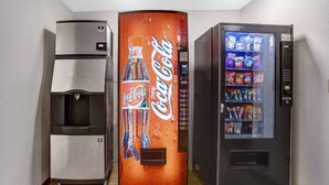 A vending machine with a Coca-Cola logo, a beverage dispenser, and a snack vending machine. - 2 Queen Beds | Non-Smoking, Micfridge (Silver City NM)