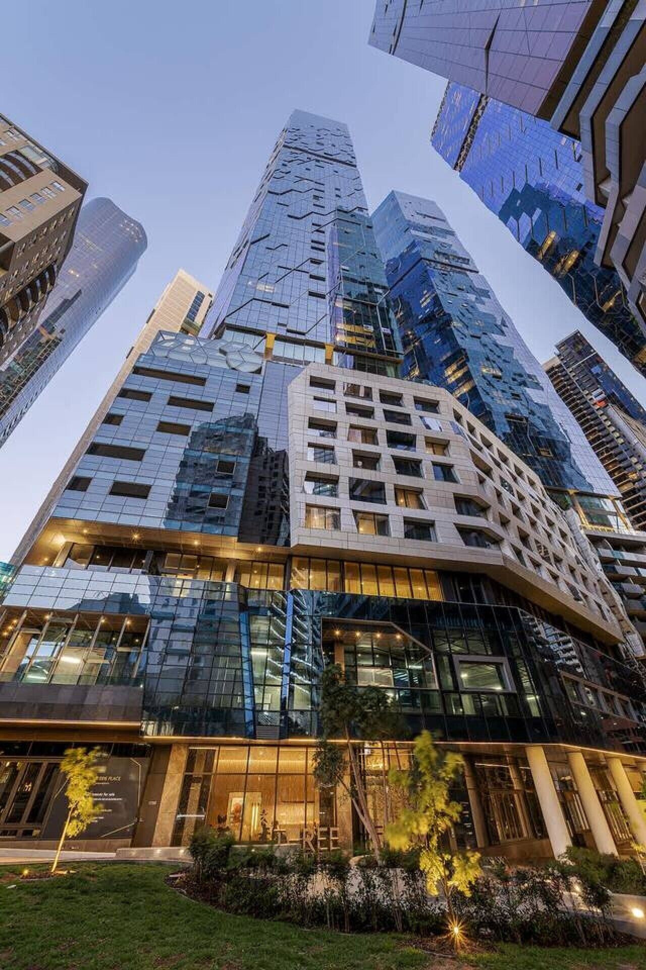 A high-rise building with multiple floors, large windows, and a modern architectural design.