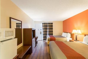A hotel room with a bed, a desk, a chair, a television, and a lamp. - 2 Queen Beds | Non-Smoking, Micfridge (Butte)