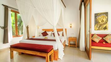 A bedroom with a four-poster bed, a bedside table, a nightstand, and a wall-mounted lamp.