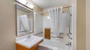 A bathroom with a sink, mirror, shower, and bathtub. - 2 Full Beds | Non-Smoking, Micfridge (Norman)