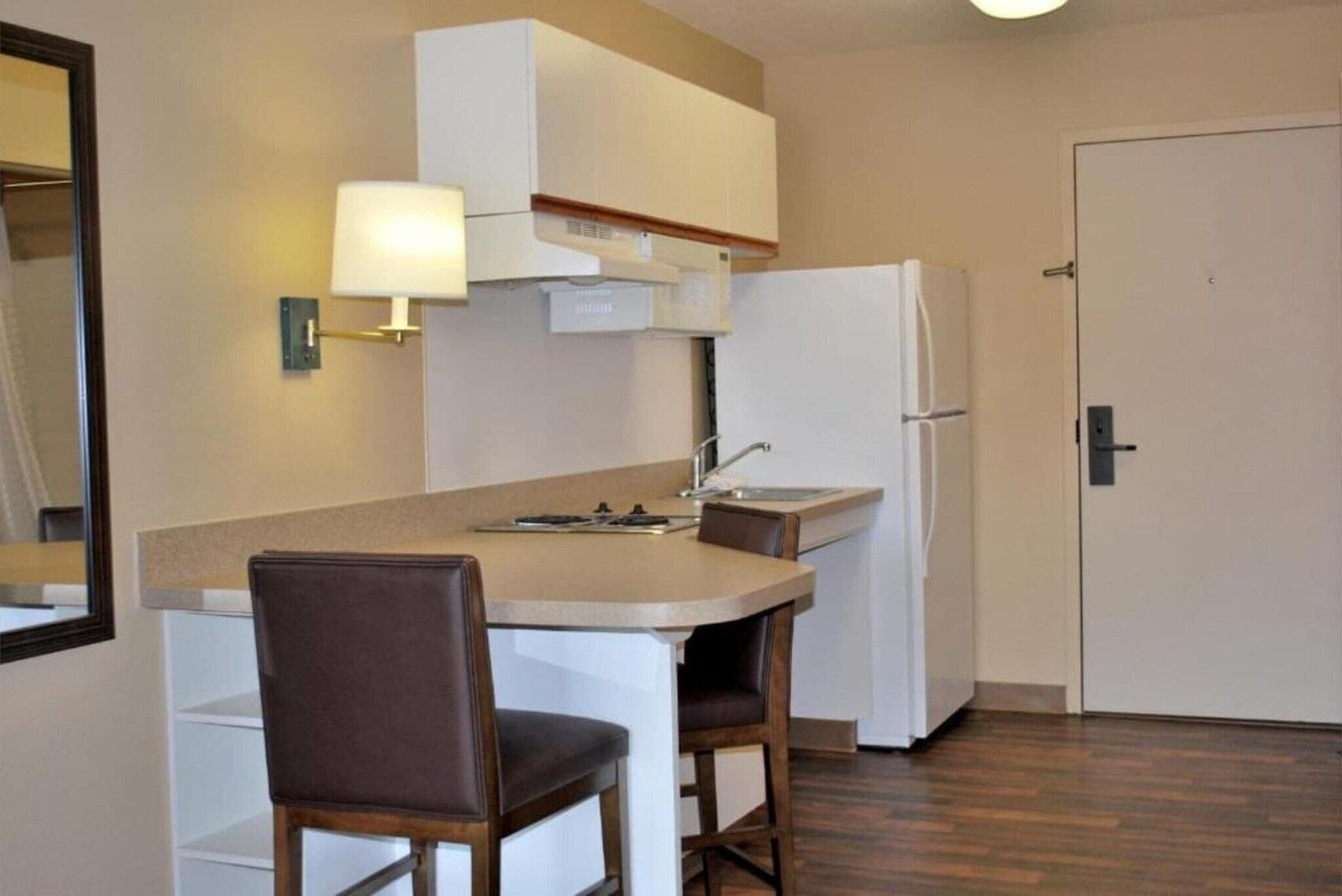 Fridge, microwave, stovetop, dining table