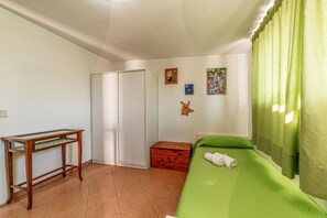A room with a bed, a desk, a wardrobe, and a small chest of drawers. - LDG Exclusive Places Rome (Tor Lupara)
