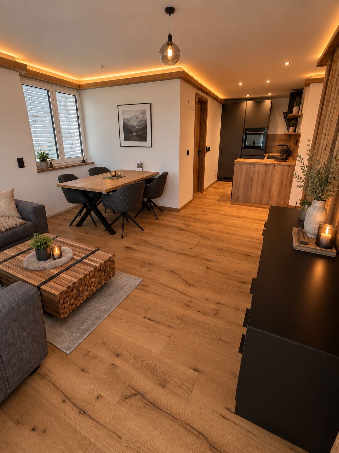 Un espacio de estar moderno con comedor, cocina y zona de estar.