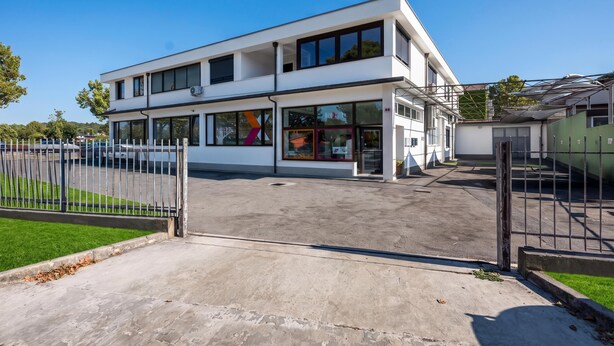 A modern two-story building with large windows and a flat roof. - Alter 26 Urban Apartment With Free Parking (Koper)