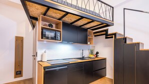 A compact kitchen with a built-in microwave, a sink, and a dishwasher. - Alter 26 Urban Apartment With Free Parking (Koper)