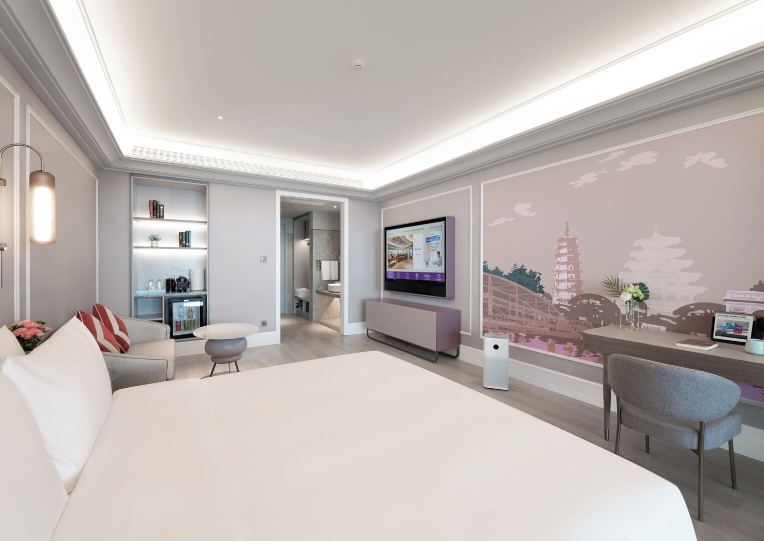 A modern hotel room with a large bed, a seating area, a TV, and a decorative wall.