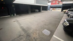 A parking garage with multiple levels and a covered area.