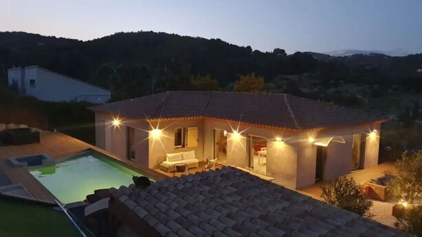 A house with a swimming pool, outdoor seating, and a patio area. - Separate master bedroom (Bandol)