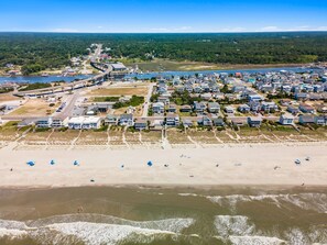 An aerial view of a coastal residential area with houses, a beach, and a marina. - Birdie Dunes | Private Pool | Walk to Beach | Holden Beach (Holden Beach)