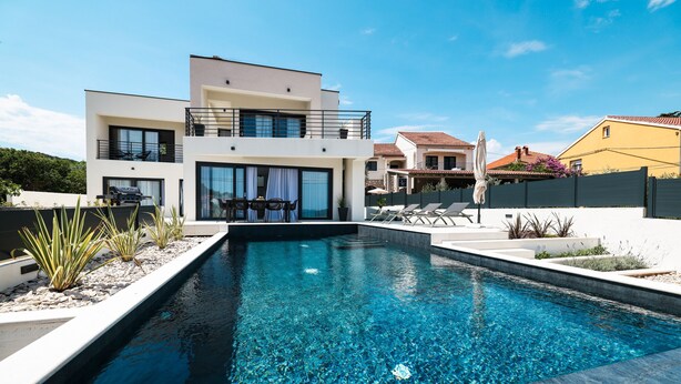 A modern two-story house with a swimming pool in the foreground. - Villa Anamaria Zadarvillas (Zadar)