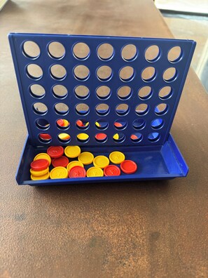 A blue tray with multiple circular holes and a collection of yellow and red lids. - Villa with Pool, Jacuzzi, Sauna, and Hammam in Marrakech (Marrakech)