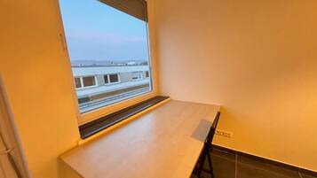 Quarto casal, vista para a cidade | Opções para refeição
