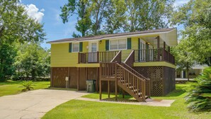 A two-story building with a balcony and a staircase leading to the upper floor. - Walk to Beach! Water-view Fairhope Retreat (Fairhope)