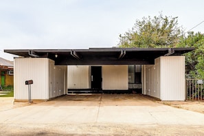 A modern building with a covered entrance, a mailbox, and a gated area. - Colorado River Family Escape in Bullhead City (Bullhead City)