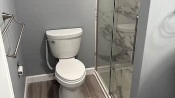 Shower, towels, soap, toilet paper