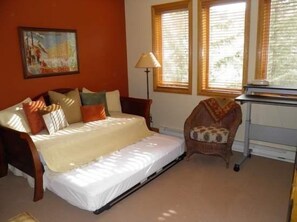 A bedroom with a bed, a chair, a desk, and a window. - Strawberry Park Condos With Easy Ski-in Ski-out Access Steps Away From Center Of Beaver Creek Village 1 Bedroom Condo (Avon)