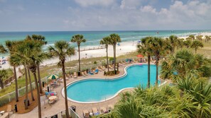 A pool area with lounge chairs and a view of the beach and ocean. - Grand Escape! 3BR 3BA Sleeps 8 Gulf Views (Panama City Beach)