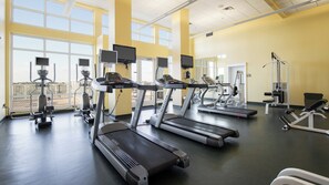 A gym with multiple treadmills, weight machines, and exercise equipment. - Grand Escape! 3BR 3BA Sleeps 8 Gulf Views (Panama City Beach)