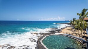 A coastal hotel with a pool, ocean view, and palm trees. - New Listing, Casa De Emdeko, Ocean views,AC (Kailua Kona)