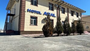 A two-story building with the sign 'HOTEL AVAL' indicating it is a hotel. - Aral Hotel (Nukus)