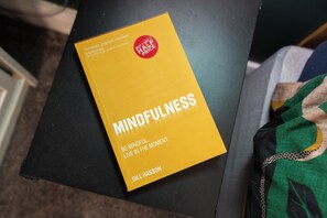 A book titled 'Mindfulness' by Gill Hasson on a black surface. - Near Cavern Club 2-storey Westminster (Liverpool)